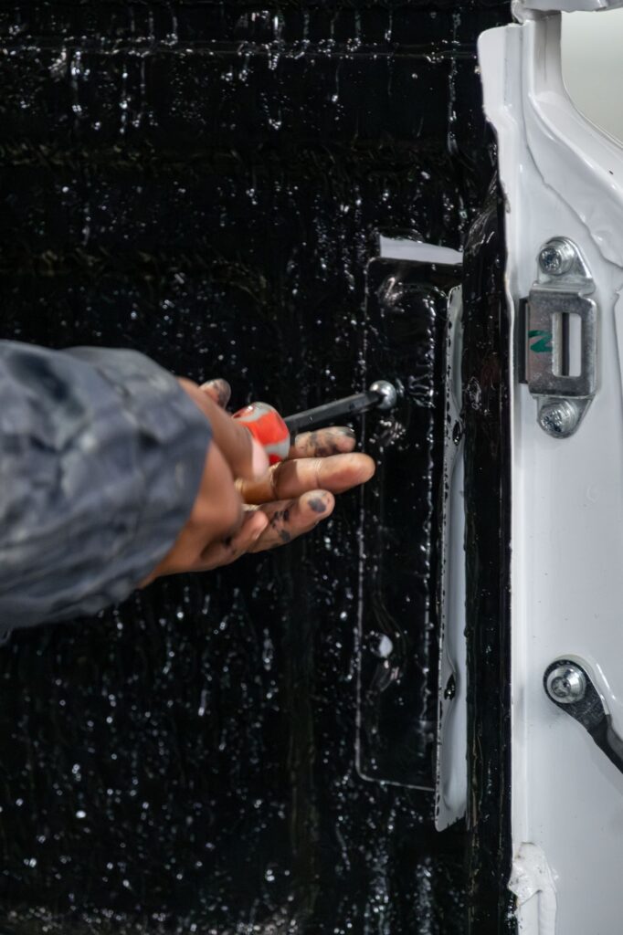Close up of a canopy lock being fitted by an Auto Enhance technician
